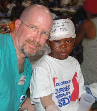 Robert Dutruch spends some time with a young patient.